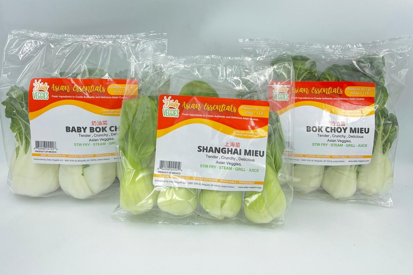 Retail bags of baby bok choy, Shanghai miu and bok choy miu packed at our facility